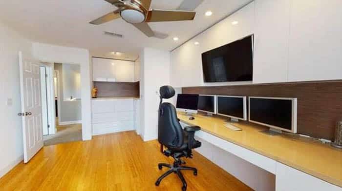 Office room with modern built in desk and cabinet